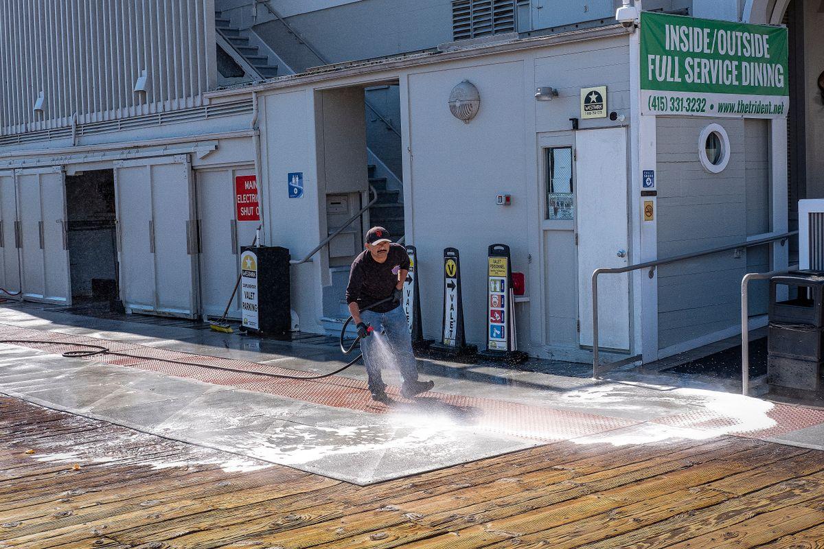 Outdoor pavement being pressure washed